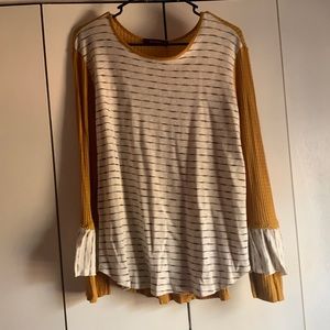 Adorable mustard, with black and white striped shirt
